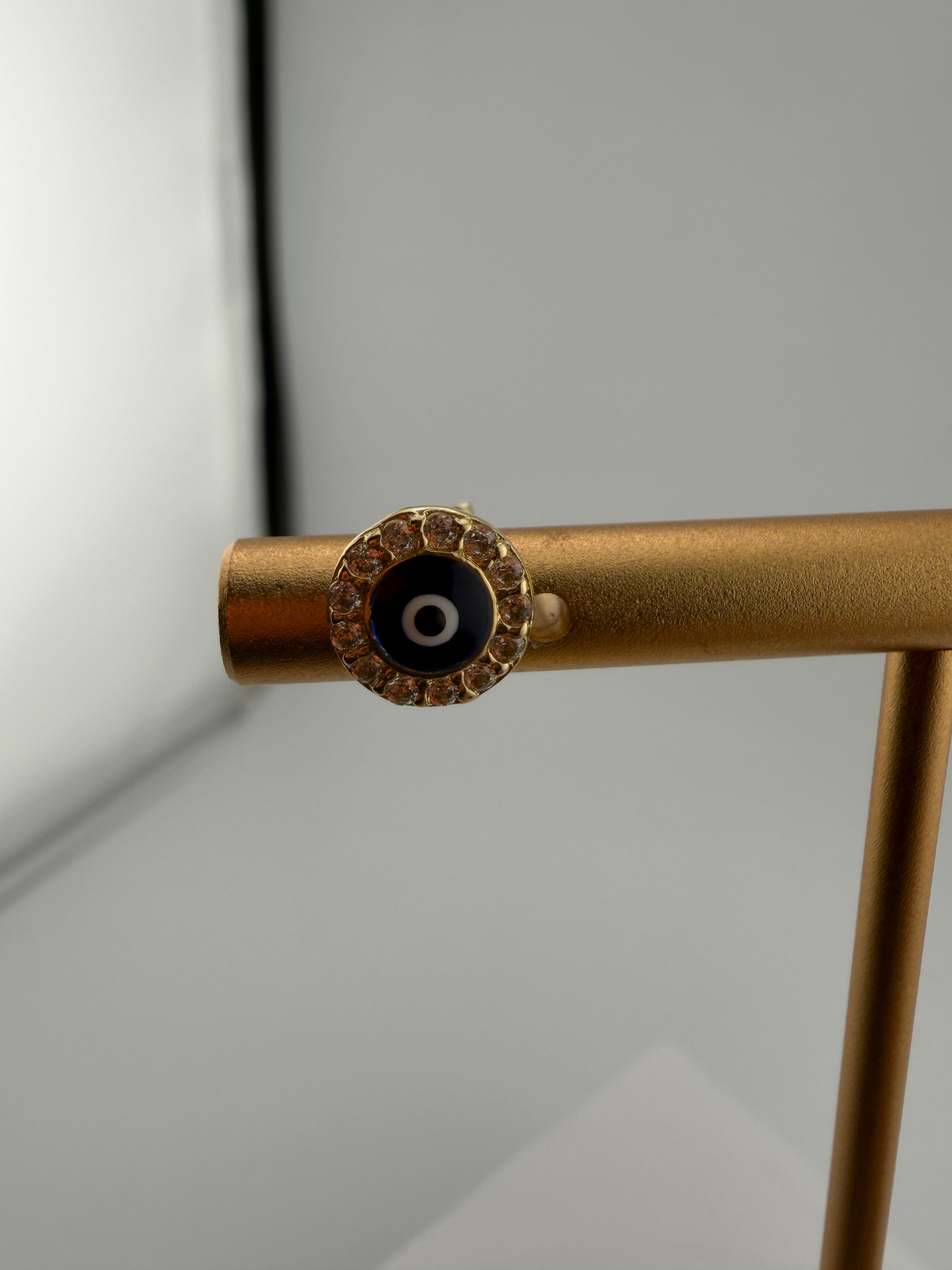 Close-up of a brass pipe fitting on a gray background